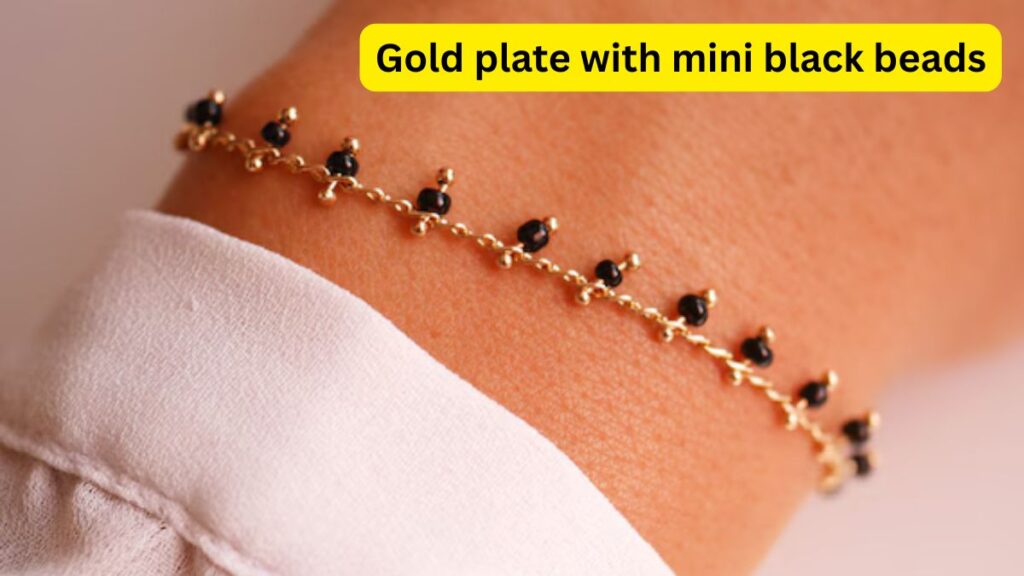 Gold plate with mini black beads